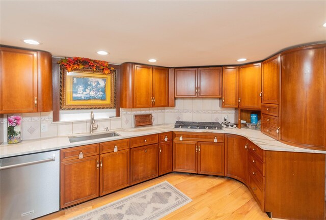 65 Berkshire Trl, Smallwood, NY 12720 - kitchen featuring appliances with stainless steel finishes, brown cabinets, light wood finished floors, light countertops, and recessed lighting