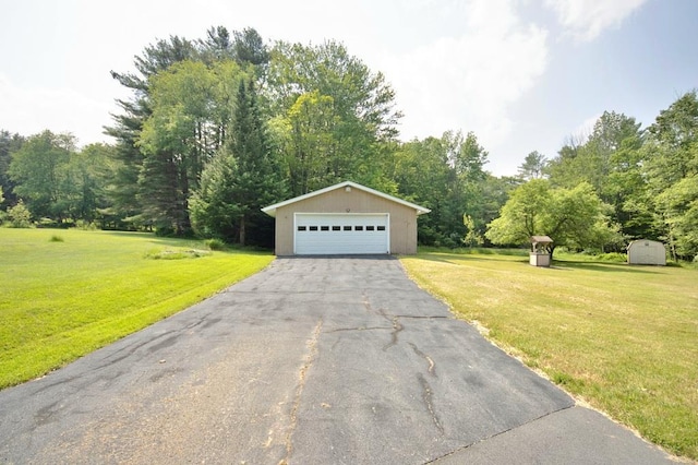 169 Mitchell Pond Rd E, Cochecton, NY 12726 - view of front of home featuring an outbuilding, a detached garage, a front yard, and view of wooded area