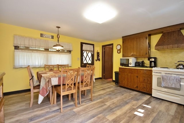 169 Mitchell Pond Rd E, Cochecton, NY 12726 - dining area with light wood-style flooring and baseboards