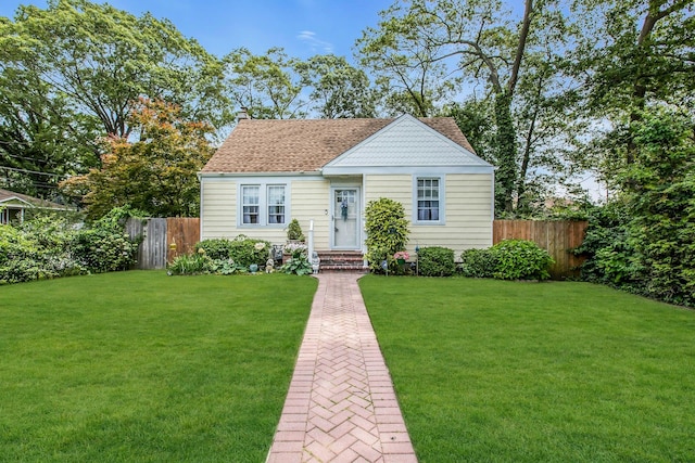 15 Robbins Ave, Islip, NY 11751 - view of front of property featuring roof with shingles, a chimney, and entry steps