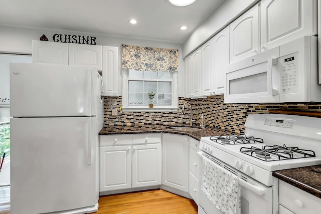 15 Robbins Ave, Islip, NY 11751 - kitchen featuring white appliances, white cabinetry, decorative backsplash, light wood-style floors, and recessed lighting