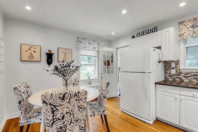 15 Robbins Ave, Islip, NY 11751 - dining room with light wood-type flooring and recessed lighting
