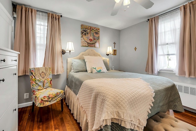 15 Robbins Ave, Islip, NY 11751 - bedroom with radiator heating unit, multiple windows, and wood-type flooring
