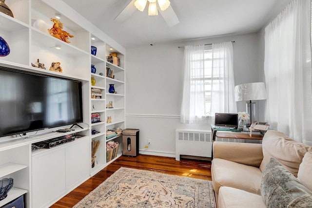 15 Robbins Ave, Islip, NY 11751 - living room with radiator, dark wood-style flooring, a ceiling fan, and an office area