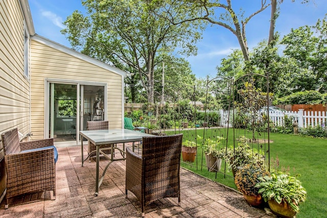 15 Robbins Ave, Islip, NY 11751 - deck with outdoor dining space, a fenced backyard, and a patio area