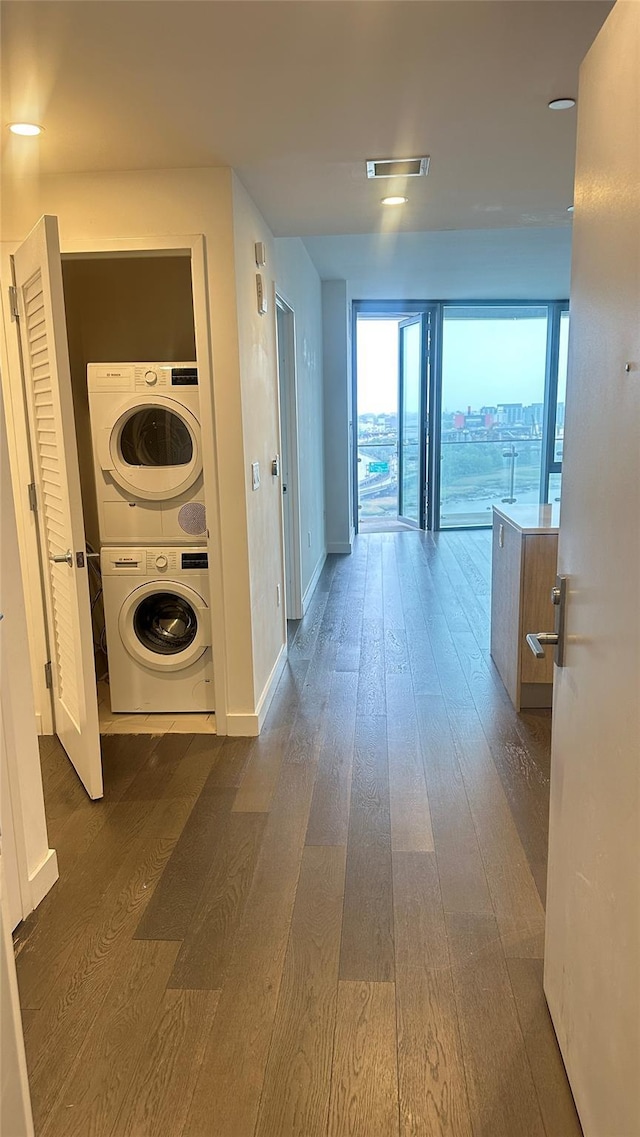 131-05 40th Rd Unit 11H, Flushing, NY 11354 - corridor with stacked washer / dryer and dark wood-style floors