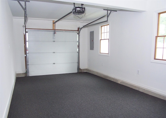 33 Roosevelt Ave, Selden, NY 11784 - garage with a garage door opener and baseboards