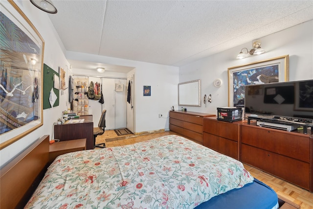 1901 Madison Ave Unit 105, New York Manhattan, NY 10035 - bedroom with a textured ceiling, an office area, and a closet
