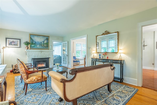 16 Beechwood Park, Poughkeepsie, NY 12601 - living area with a stone fireplace and light wood-style floors