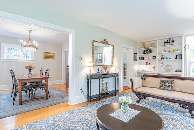 16 Beechwood Park, Poughkeepsie, NY 12601 - living room with a chandelier, wood finished floors, and plenty of natural light