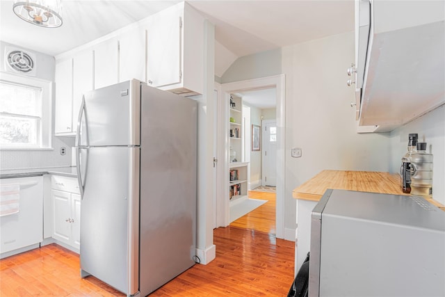 16 Beechwood Park, Poughkeepsie, NY 12601 - kitchen with freestanding refrigerator, light wood finished floors, white cabinets, and light countertops