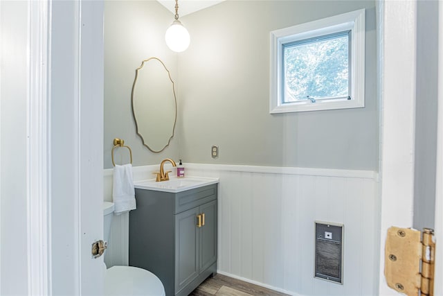 16 Beechwood Park, Poughkeepsie, NY 12601 - bathroom featuring wainscoting, vanity, heating unit, and wood finished floors