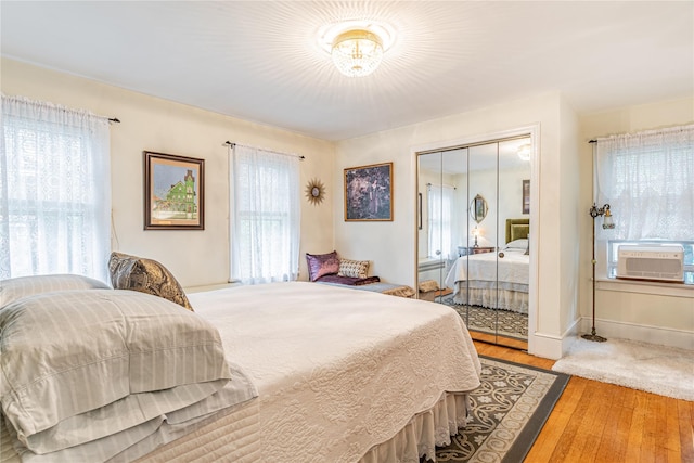 16 Beechwood Park, Poughkeepsie, NY 12601 - bedroom with cooling unit, wood finished floors, and a closet