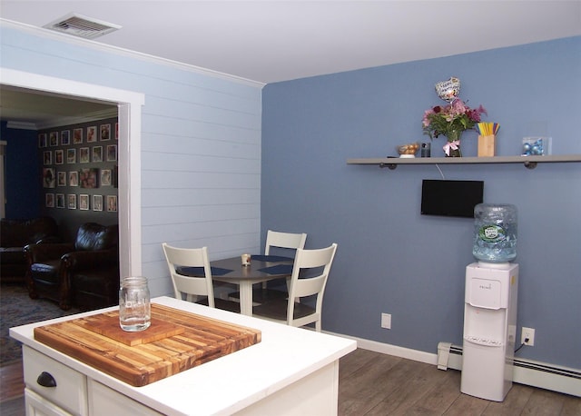 4 Bowman Ln, Commack, NY 11725 - dining room with wood finished floors and baseboard heating