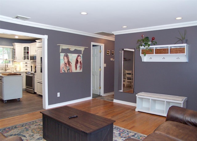 4 Bowman Ln, Commack, NY 11725 - living area featuring dark wood finished floors, crown molding, and recessed lighting