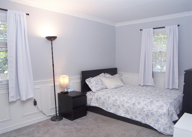 4 Bowman Ln, Commack, NY 11725 - carpeted bedroom featuring crown molding, a decorative wall, and wainscoting