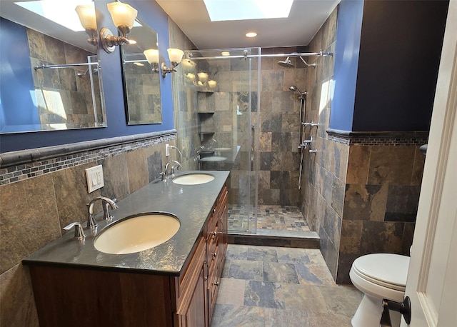 4 Bowman Ln, Commack, NY 11725 - full bath featuring tile walls, a stall shower, double vanity, stone finish flooring, and recessed lighting