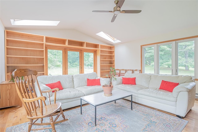 2136 Rte 55, Lagrangeville, NY 12540 - living room with a skylight, vaulted ceiling, light wood-type flooring, built in features, and ceiling fan