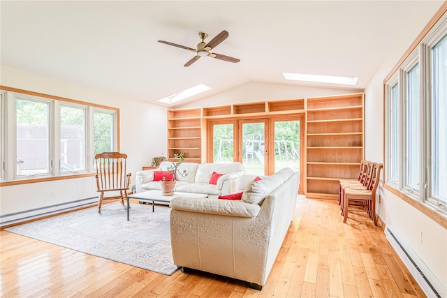 2136 Rte 55, Lagrangeville, NY 12540 - living area with a skylight, a baseboard heating unit, built in shelves, lofted ceiling, and light wood-style floors