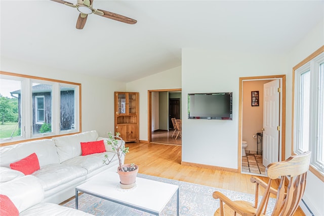 2136 Rte 55, Lagrangeville, NY 12540 - living room featuring lofted ceiling, light wood-style floors, baseboard heating, and a ceiling fan