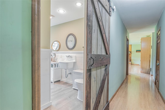 2136 Rte 55, Lagrangeville, NY 12540 - hall with a barn door and light wood-style flooring