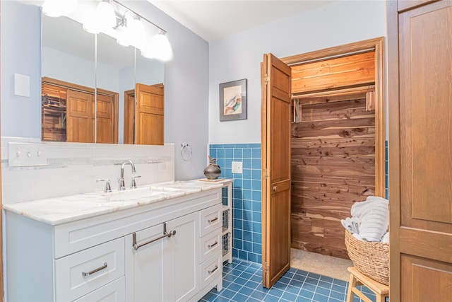 2136 Rte 55, Lagrangeville, NY 12540 - bathroom with vanity, tile patterned flooring, tile walls, and wainscoting
