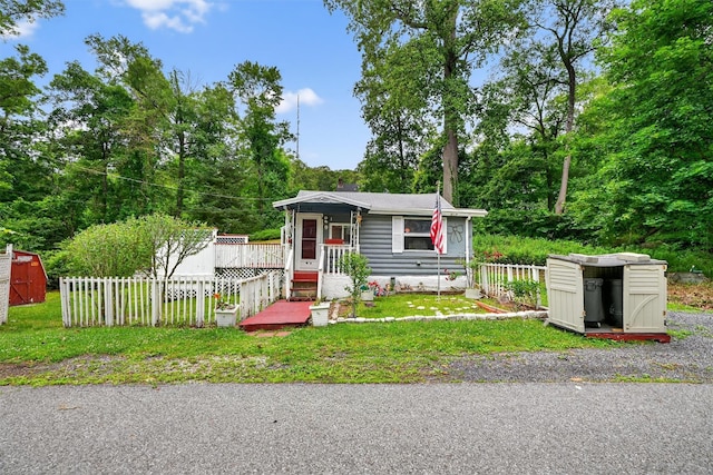 9 Mimosa St, Lake Peekskill, NY 10537 - view of front of house with a shed