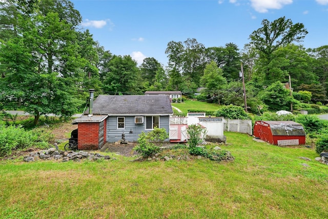 9 Mimosa St, Lake Peekskill, NY 10537 - rear view of property with an outbuilding and a wooden deck
