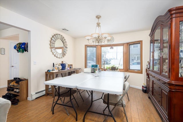 755 E Chester St, Long Beach, NY 11561 - dining area with a chandelier, light wood-style flooring, and a baseboard radiator