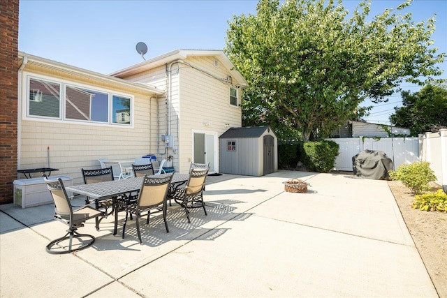 755 E Chester St, Long Beach, NY 11561 - view of patio with a storage shed, outdoor dining area, and an outdoor fire pit