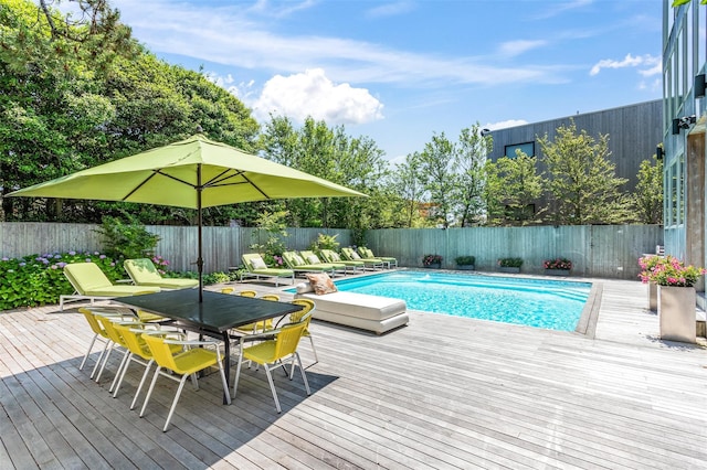 172 Pine Walk, Fire Island Pines, NY 11782 - view of swimming pool with a fenced backyard, a wooden deck, and outdoor dining space