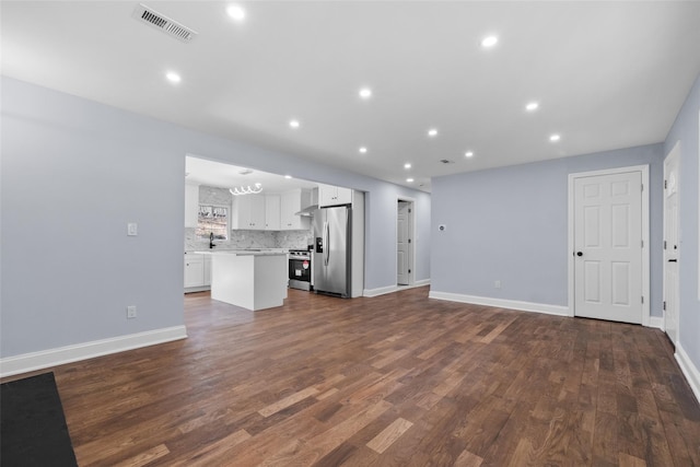 48 Lockwood Rd, South Salem, NY 10590 - unfurnished living room featuring dark wood-style flooring and recessed lighting