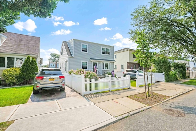 4911 168th St, Flushing, NY 11365 - view of front of home with a fenced front yard