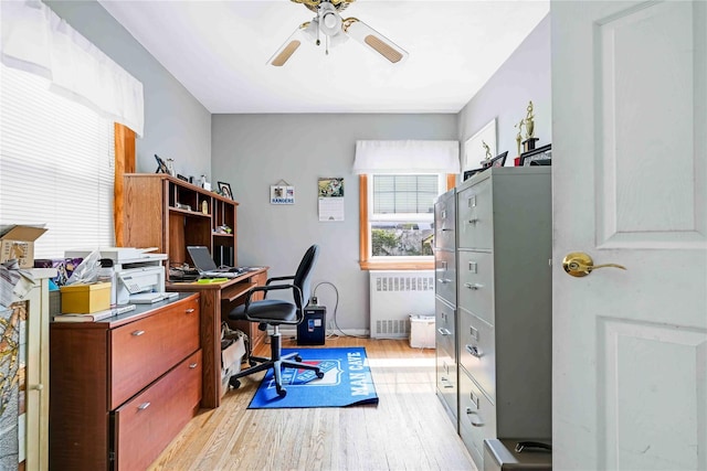 4911 168th St, Flushing, NY 11365 - office with radiator, light wood-style flooring, and a ceiling fan