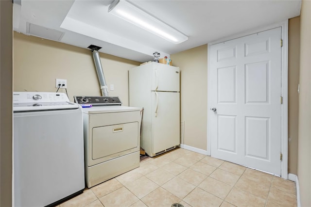 4911 168th St, Flushing, NY 11365 - laundry area with separate washer and dryer and light tile patterned floors