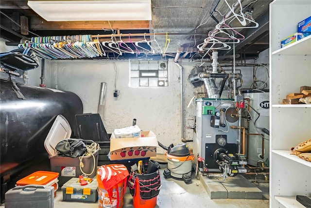 4911 168th St, Flushing, NY 11365 - garage featuring heating fuel, water heater, and a heating unit