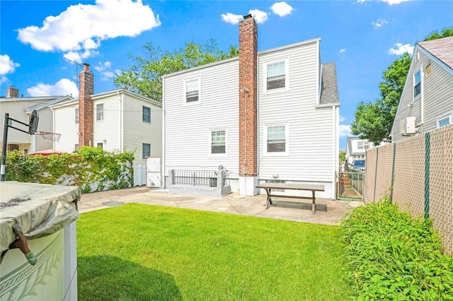 4911 168th St, Flushing, NY 11365 - rear view of house with a chimney and a patio