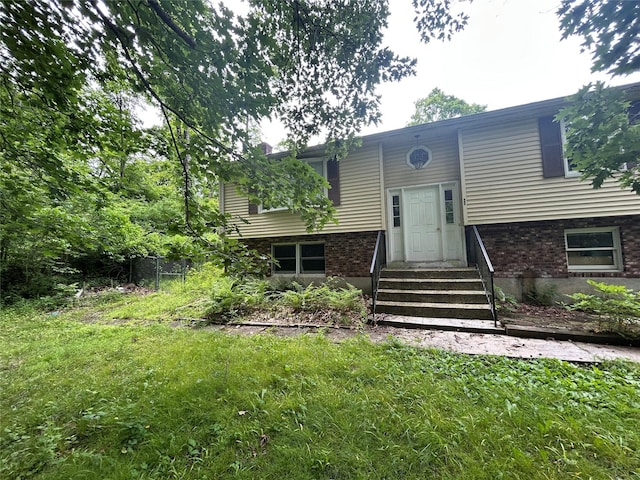 421 Rte 164, Brewster, NY 12563 - view of front of house with entry steps, brick siding, and a front yard