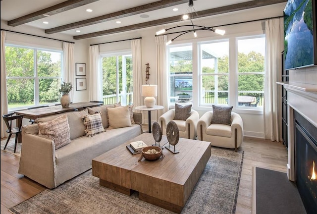 4039 Fairways Dr Unit 120, Carmel, NY 10512 - living room featuring beamed ceiling, wood finished floors, and a chandelier