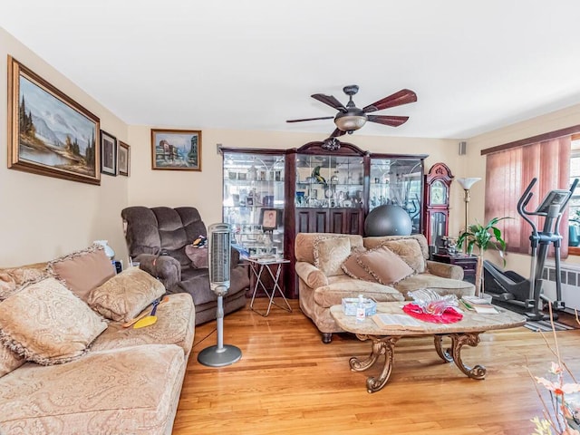 1405 E 233rd St, Bronx, NY 10466 - living area with wood finished floors, ceiling fan, and radiator