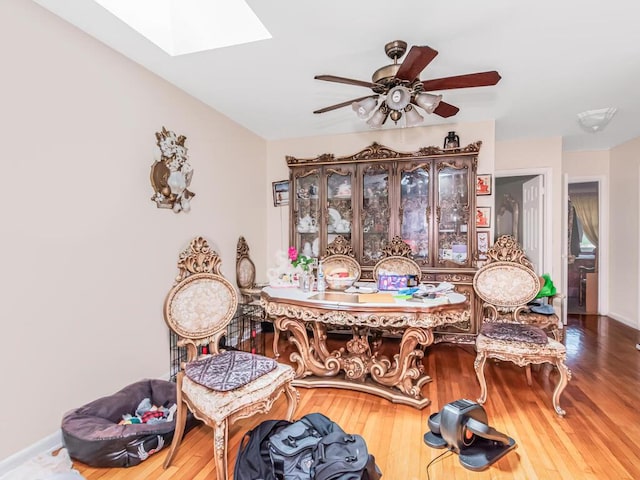 1405 E 233rd St, Bronx, NY 10466 - dining area featuring a ceiling fan, a skylight, and wood finished floors