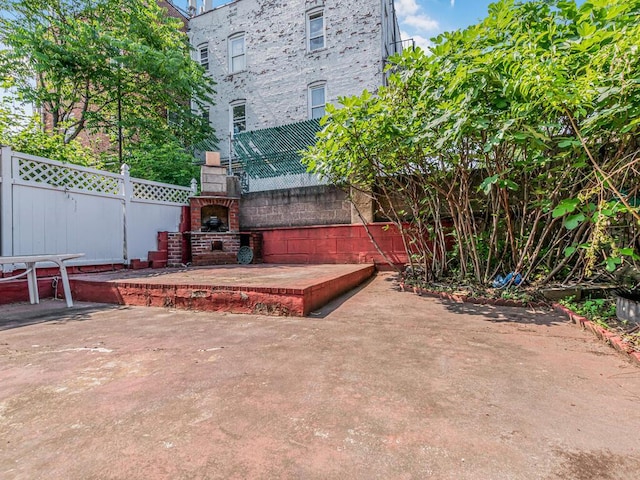 1405 E 233rd St, Bronx, NY 10466 - view of patio / terrace featuring an outdoor brick fireplace