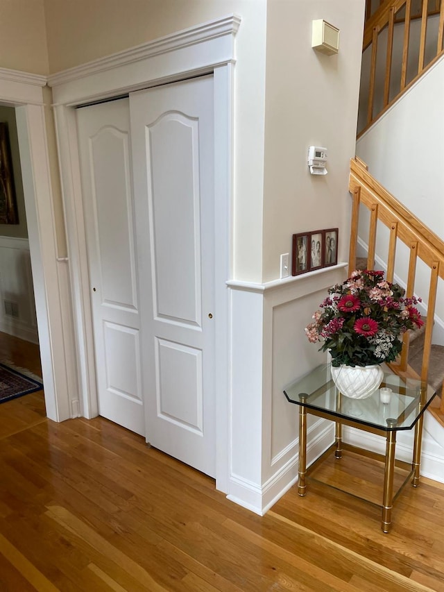 133 Woodbrook Rd, White Plains, NY 10605 - corridor featuring wood finished floors and stairs