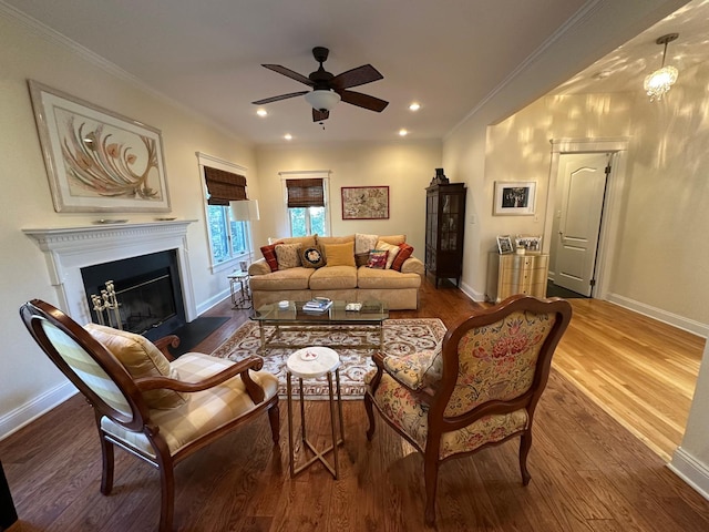 133 Woodbrook Rd, White Plains, NY 10605 - living room featuring a ceiling fan, wood finished floors, crown molding, a glass covered fireplace, and recessed lighting