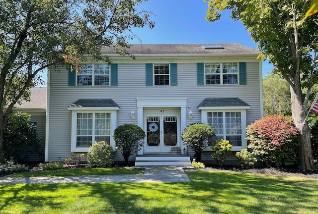43 Southfield Rd, Baiting Hollow, NY 11933 - view of front of home with a front lawn and roof with shingles