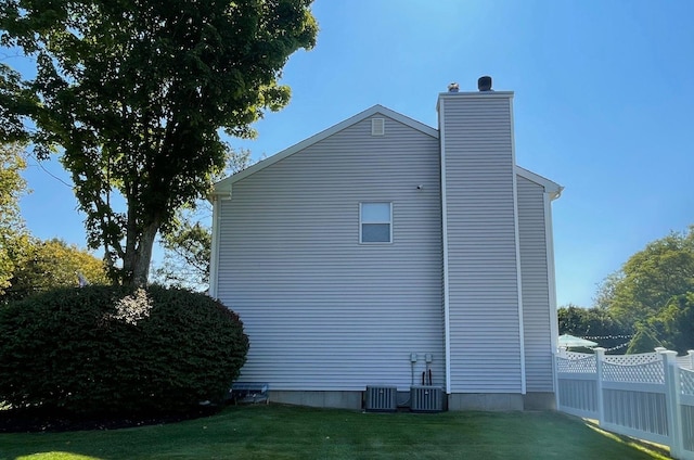 43 Southfield Rd, Baiting Hollow, NY 11933 - view of side of home with a chimney and a cooling unit