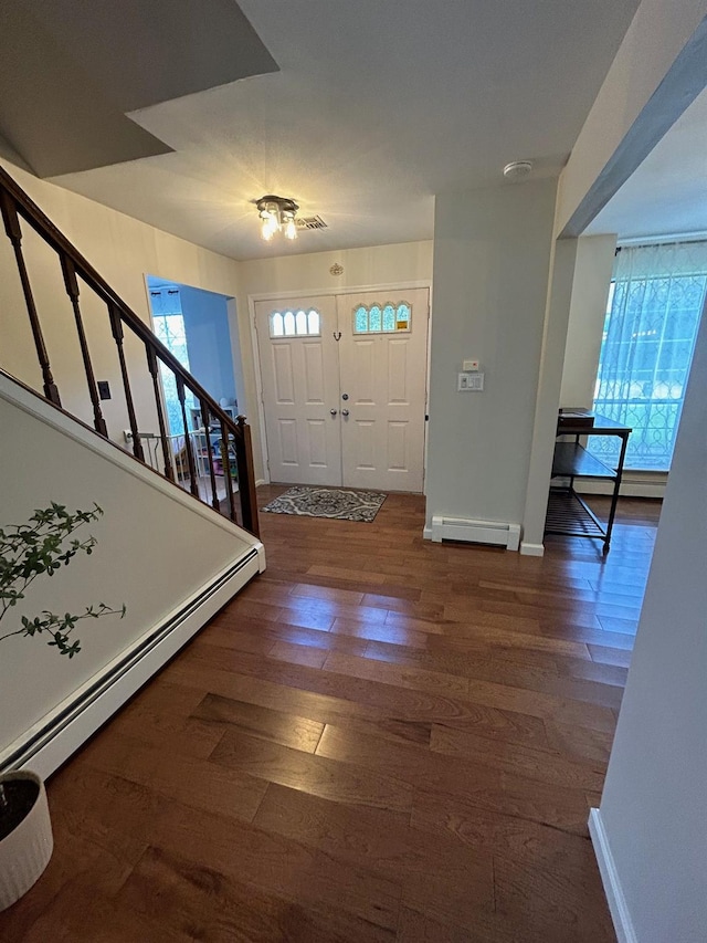 43 Southfield Rd, Baiting Hollow, NY 11933 - foyer with a baseboard radiator, stairway, wood finished floors, and baseboard heating