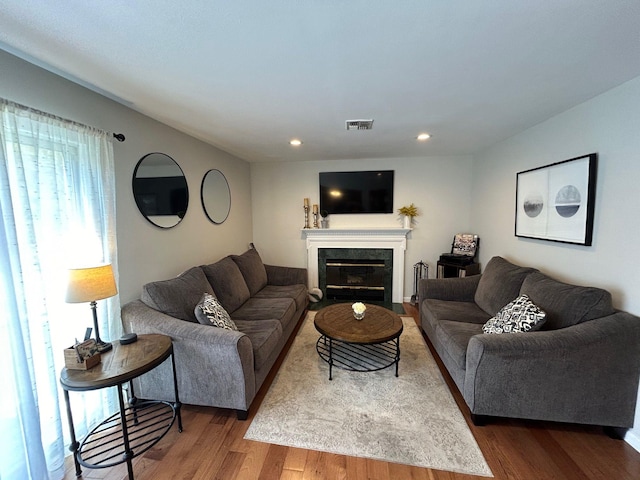 43 Southfield Rd, Baiting Hollow, NY 11933 - living area with wood finished floors, a fireplace with flush hearth, and recessed lighting