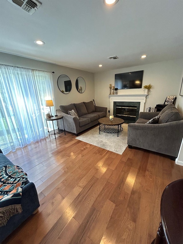 43 Southfield Rd, Baiting Hollow, NY 11933 - living area featuring a premium fireplace, wood finished floors, and recessed lighting