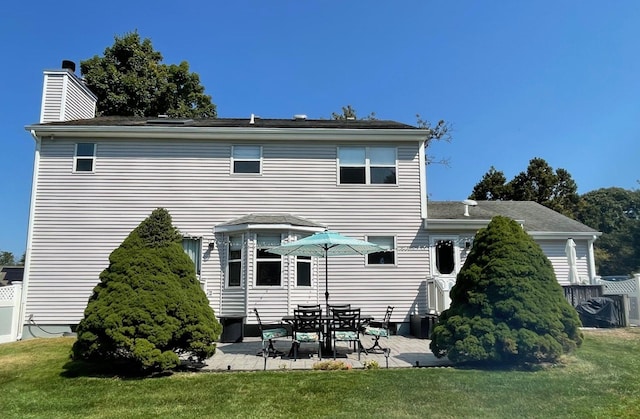 43 Southfield Rd, Baiting Hollow, NY 11933 - back of property with a patio area and a chimney